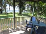 King Reef Resort Van Park - Kurrimine Beach North: Deck on Deluxe spa cabin.