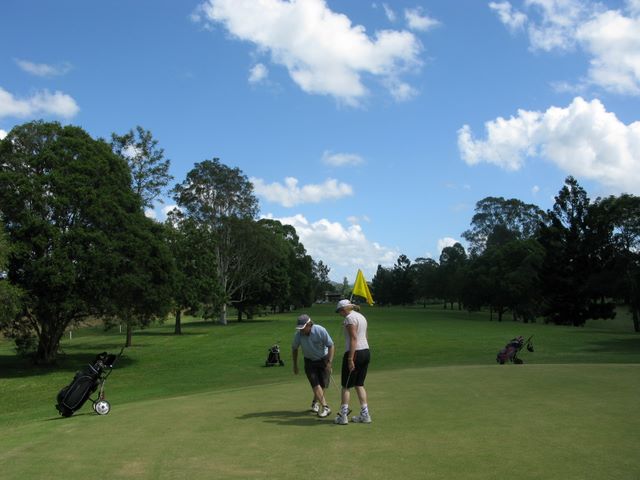 Kyogle Golf Course - Kyogle: Green on Hole  1 looking back along the fairway.