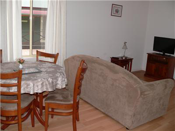 Laura Community Caravan Park - Laura: Lounge and dining area in cottage