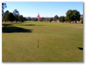Lowood and District Golf Club - Lowood: Green on Hole 3 looking back along the fairway.