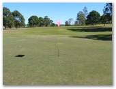 Lowood and District Golf Club - Lowood: Green on Hole 9 looking back along the fairway.