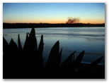 Maclean NSW: Sugar can burning at sunset.