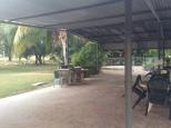 Territory Manor Caravan Park - Mataranka: Camp kitchen with spa in background