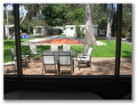 Crystal Brook Tourist Park - Doncaster East Melbourne: Outlook from Camp Kitchen showing Jumping Pillow.