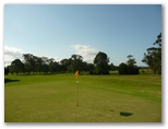 Mullumbimby Golf Course - Mullumbimby: Green on Hole 15 looking back along the fairway.