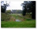 Muree Golf Club - Raymond Terrace: Fairway view Hole 8 with water in immediate foreground