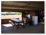 Rose Gardens Tourist Park retained for historical purposes - Narromine.: Camp kitchen and BBQ area with view of adjacent field