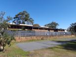 Halifax Holiday Park - Nelson Bay: Amenities with green matting sites in front