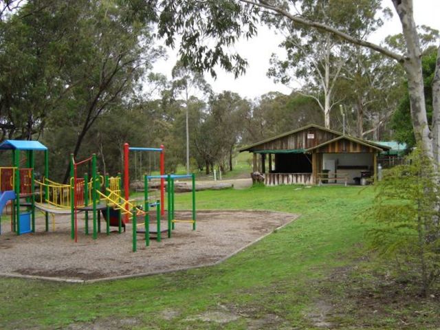 Lakes Bushland Caravan Park - Nicholson: Playground for children. With Camp Kitchen in the background.