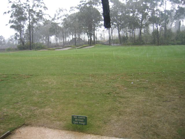 Pacific Dunes Golf Course - Medowie: Green on Hole 15 during rain shower
