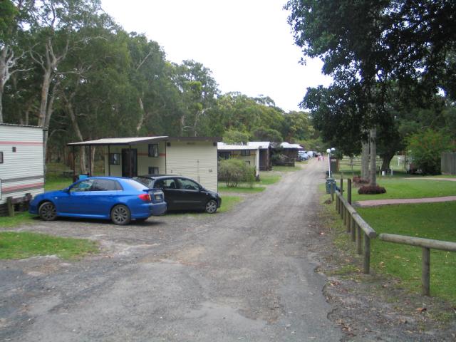 Sandbar & Bushlands Holiday Parks - Sandbar: Sandbar Caravan Park showing the cabins on the left that front the lake. At the far end of the roadway is access to the lake where small boats can be launched.  The caravan and camping area is on the right. 