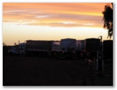 Pardoo Roadhouse Caravan Park - Pardoo: Trucks at sunset.