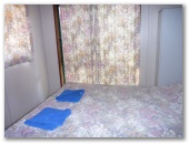 Currajong Caravan Park - Parkes: Interior of cabin showing bedroom
