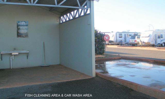 The Cove Caravan Park - Point Samson: Fish cleaning area and car wash area.