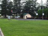 Gardens By East Beach Caravan Park - Port Fairy: Basket ball courts and exit gate and peak season entry  office.