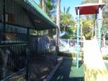Melaleuca Caravan Park - Port Macquarie: Play area by aviary 
