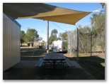 Premer Lions Park Caravan Park - Premer: Sheltered picnic table in front of tennis club