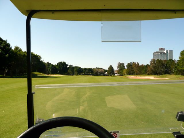Royal Pines Golf Course - Benowa: Approach to the Green on Hole 9 with resort in the background