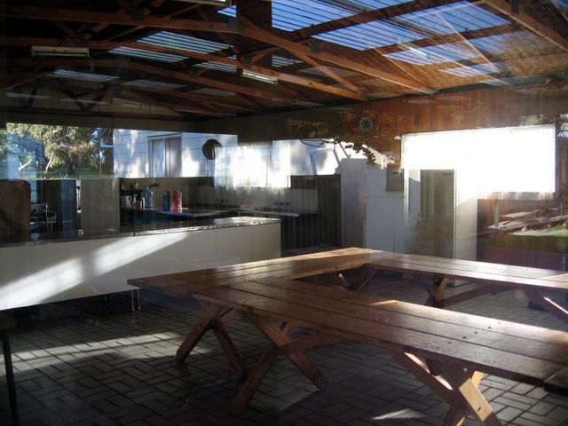 Gemini Downs Holiday Centre - Salt Creek: Dining room and camp kitchen (photo taken through glass door)