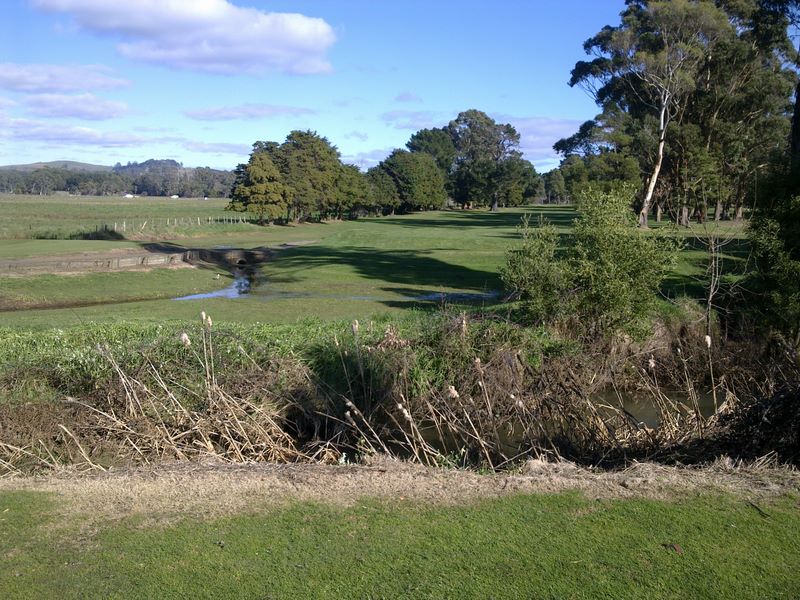 Seabrook Golf Club Inc. - Wynyard: Fairway view on Hole 2 with challenging water and gully.