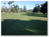 Seabrook Golf Club Inc. - Wynyard: Green on Hole 8 looking back along the fairway.
