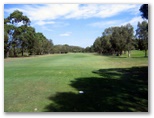 South West Rocks Golf Course - South West Rocks: Fairway view Hole 3 - the green is beyond the left turn