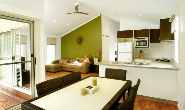 South West Rocks Tourist Park - South West Rocks: Dining room, lounge and kitchen in the luxury villa