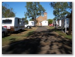 Kamarooka Tourist Park - St George: View of cabins and powered sites from the back fence.