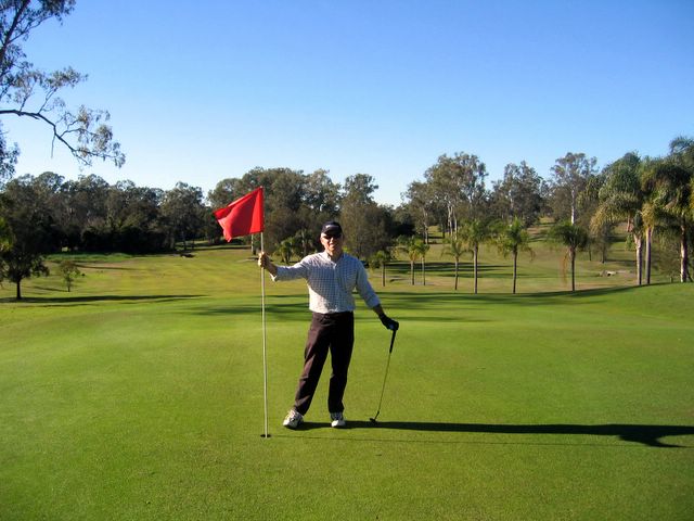 St Lucia Golf Links - St Lucia Brisbane: Hole 9 Green - my business partner Reay Mackay holds the flag