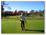 St Lucia Golf Links - St Lucia Brisbane: Holding the flag on Hole 9
