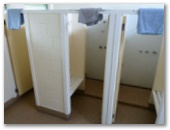 Stanley Cabin and Tourist Park - Stanley: Interior of Amenities showing showers with bath mats provided.