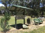 Strathbogie Cemetery - Strathbogie: Entrance sign with seat nearby.
