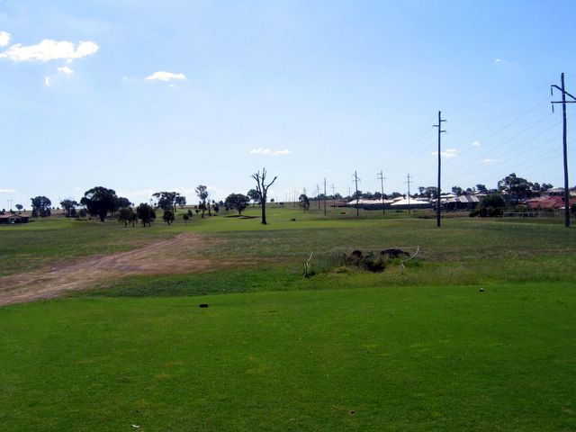 Longyard Golf Course - Tamworth: Fairway view Hole 2 with water trap to the right of the center tree