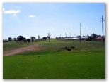 Longyard Golf Course - Tamworth: Fairway view Hole 2 with water trap to the right of the center tree