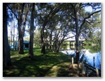 Dawson River Tourist Park - Taree: Powered sites for caravans with view of the river and bridge