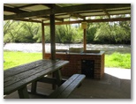 Tawonga Caravan Park - Tawonga: Interior of sheltered BBQ area with river views
