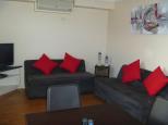 Boomerang Way Tourist Park - Tocumwal: Lounge Area of Poolside Cabin 12