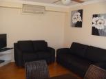 Boomerang Way Tourist Park - Tocumwal: Lounge Area of Poolside Cabin 11