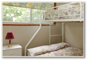 Barlings Beach Tourist Park - Tomakin: Second bedroom in Deluxe Cabin