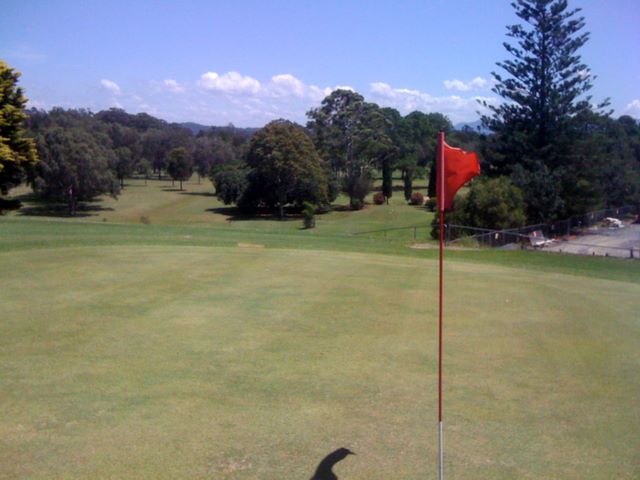Urunga Golf and Sports Club - Urunga: Green on Hole 9 looking back along the fairway.