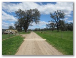 Valencia Creek Caravan Park - Valencia Creek: Road beyond the entry sign that leads to the park.