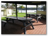 Ocean Lake Caravan Park - Wallaga Lake: Camp kitchen and BBQ area with water views
