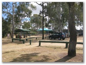 Dingo Creek Bicentennial Park - Wondai: Parking area showing sheltered outdoor BBQ